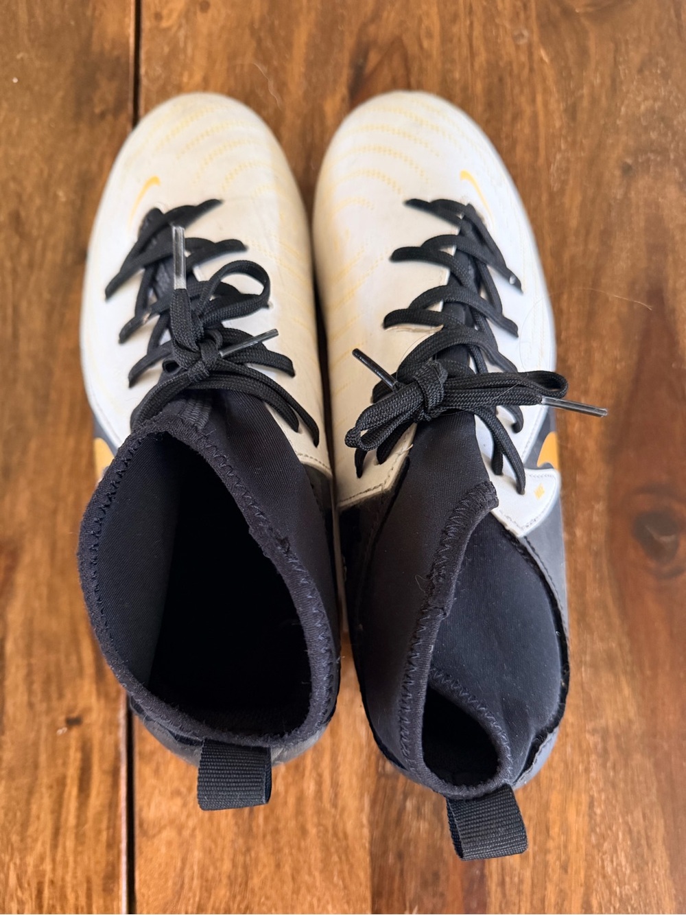 Nike White & Black Soccer Shoes with Yellow Swoosh